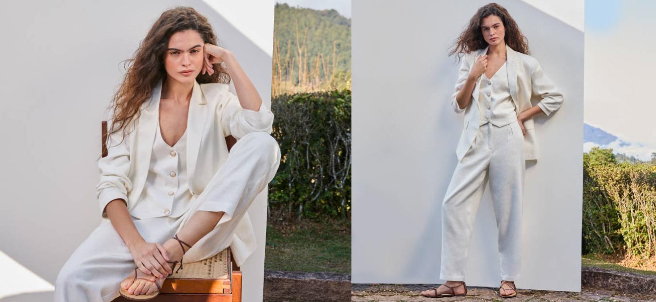 modelo posando com look em alfaiataria em frente a fundo branco representando como usar blazer feminino